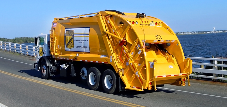 McNeilus Rear Loader Garbage Trucks | XC Extra Compaction